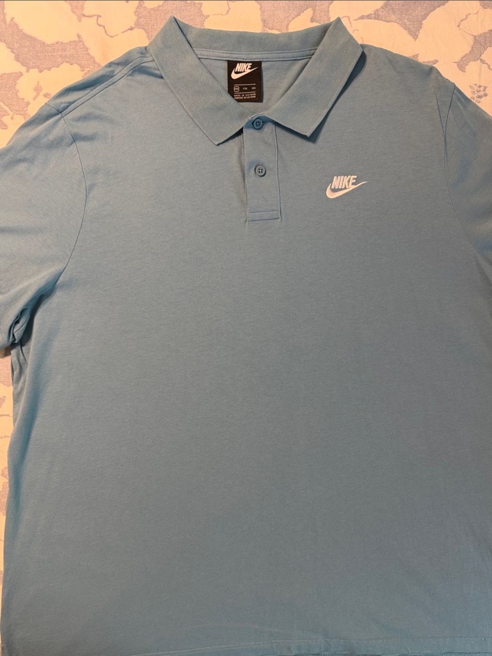 Nike Men’s Sky Blue Polo with White Swoosh